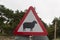 Sheep on road triangular warning sign, United kingdom.