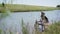 Sheepdog - lifeguard sits on the shore and looks at the lake. Dog Patrol on a Windy Day