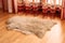 Sheepskin carpet on wooden floor