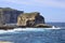 A sheer cliff blown by all winds on the island of Gozo.