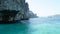 Sheer cliffs, blue water and a Viking cave. Phi Phi Islands, Thailand.