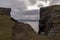 Sheer cliffs with dramatic sky on Vagar Island, Faroe Islands, Denmark
