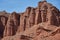 Sheer cliffs subject to erosion, red rocks of the Konorchek canyon, travel destination Kyrgyzstan, Central Asia