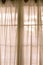 Sheer fabric window curtain with filtered light