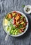 Sheet pan chicken and vegetables rice bowl - delicious diet balanced lunch on a grey background