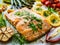 Sheet pan dinner - roasted salmon steak with asparagus, lemon ,rosemary, tomatoes, onion and garlic on cooking pan on wooden table