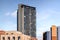 Sheffield steel city skyline with bright blue summer sky and birds flying past skyscraper block of flats tower. Modern housing.