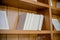 Shelf with books. White Books, knowledge, education concept. Interior details.Selective focus.Bookshelf.stack of books