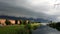 Shelf cloud above the Nesselande district in Rotterdam, The Netherlands where an aircraft is flying trough