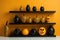 A shelf filled with black and orange vases. Generative AI image.