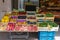 Shelf with fresh fruits and herbs in greengrocery store