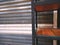 Shelf In Front Of Metal Foldable Corrugated Door