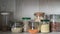 Shelf in the kitchen with various jars of cereals. Glass jars with pasta, lentils, couscous, beans and a container of buckwheat.