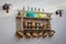 Shelf with old colorful sifon bottles and ceramic cups