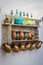 Shelf with old colorful sifon bottles and ceramic cups