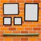 Shelf photo frames brick background