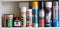 Shelf of spraypaint and lubricants for the average home handyman