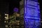 Shell Centre building in South Bank, London lit up blue at night for Christmas