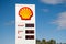 Shell fuels brand logo sign on a white stand and fuel prices for Unleaded, DIesel and Premium 98