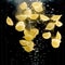 Shell-shaped pasta falling into the water on black background