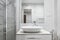 Shell-shaped white porcelain washbasin with shower tray, square