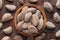 Shelled bertholletia, brazil nuts in wooden bowl, top view