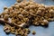 Shelled and shelled walnuts on a wooden board on the table. Healthy nutrition, vegetarianism, diet