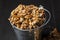 Shelled walnuts in a metal bucket