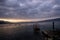 Shellfish breeding on Mediterranean sea. Mussel farm with boat on Adriatic coast. Oyster beds at low tide in oyster farm.