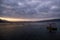 Shellfish breeding on Mediterranean sea. Mussel farm with boat on Adriatic coast. Oyster beds at low tide in oyster farm.