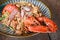 Shellfish seafood plate with lobster dinner food cooked - Grilled Lobster sausage ham vegetables and cheese spaghetti seafood on