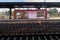 Shelter on the platform of Hundertwasser station with empty rails in the foreground