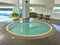 Sheltered round jacuzzi pool with sea view