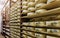 Shelves of aging Cheese at maturing cellar dairy Franche Comte