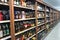 Shelves with an alcohol in a store. Large assortment of alcoholic beverages: KHARKIV, UKRAINE - 11 February, 2021