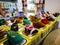 Shelves with Assortment of baby shoes in the store for sale.