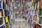 Shelves with books in a bookstore. Large selection of diverse literature. On the floor there is a marking for buyers to observe