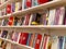 Shelves of books on sale at modern bookshop