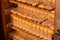 Shelves with cell curlers for the withdrawal of the queen bee in a special locker. Close up, details of beekeeping