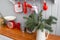 Shelves with dishes. Interior light grey kitchen and red christmas decor. Preparing lunch at home on the kitchen concept