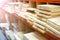 Shelves with lumber and wooden boards.