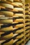 Shelves of maturing Cheese on wooden shelves