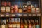 Shelves with a variety of alcoholic drinks in the supermarket. Rich choice. Blurred