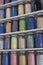 Shelving with glass jars of colorful pigments