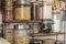 Shelving in a kitchen filled with several tiers of seasoning jars and dehydrated foods