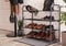 Shelving rack with stylish shoes and accessories near white brick wall indoors