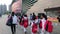 Shenzhen, China: children athletes walk past the sports square to take part in a competition