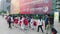 Shenzhen, China: children athletes walk past the sports square to take part in a competition