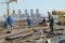 Shenzhen, China: Construction workers in handling steel