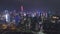 SHENZHEN, CHINA - MARCH 30, 2019: Urban Cityscape and Light Show. Futian District. Aerial View. Reveal Shot. Drone Flies
